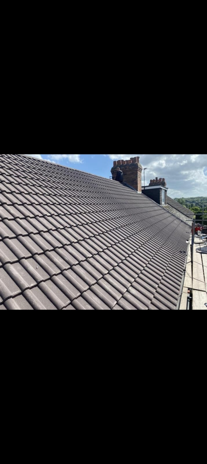 Full re-roof with new grey concrete tiles and repointed chimney Lancashire