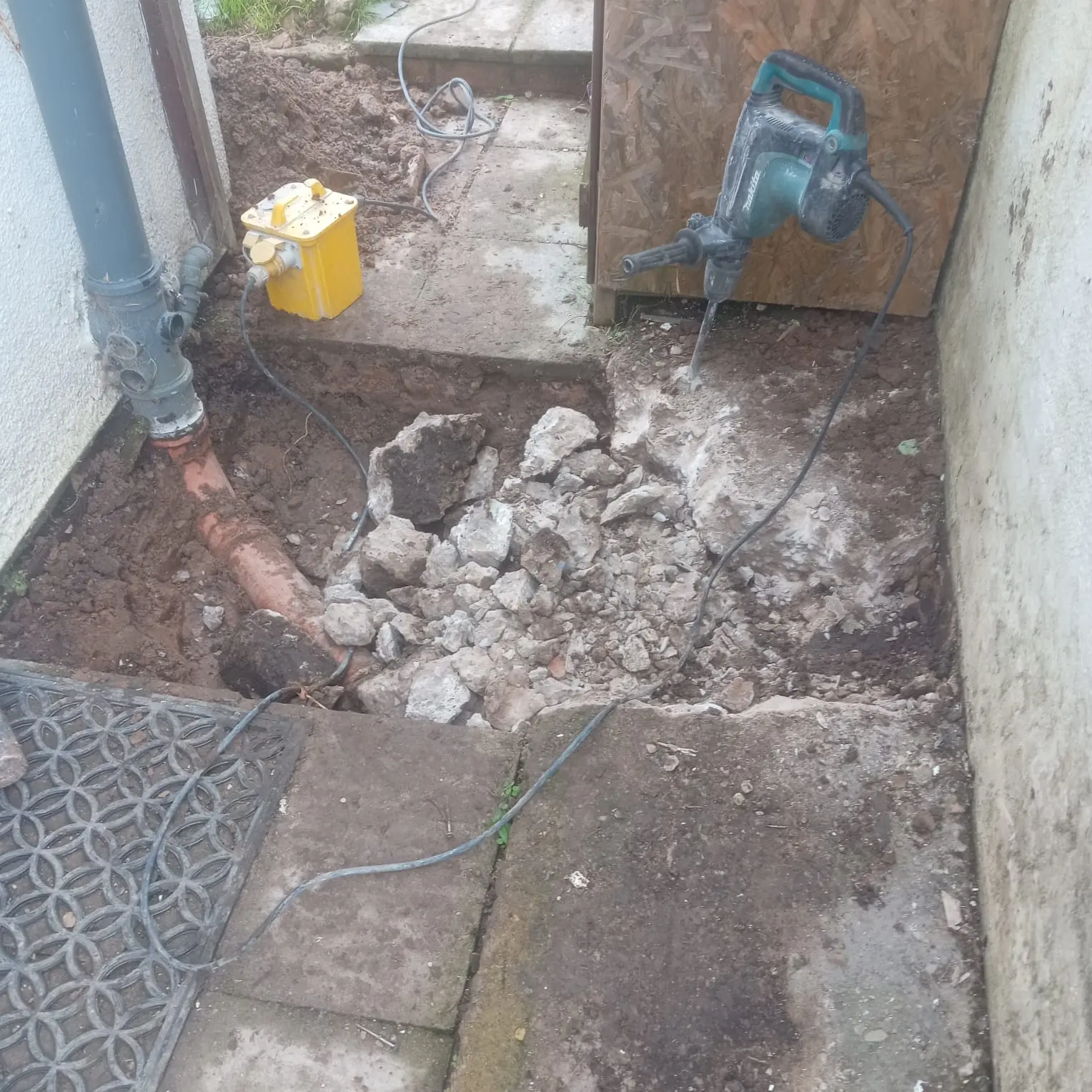 Breaking out old concrete for new drainage installation Lancashire