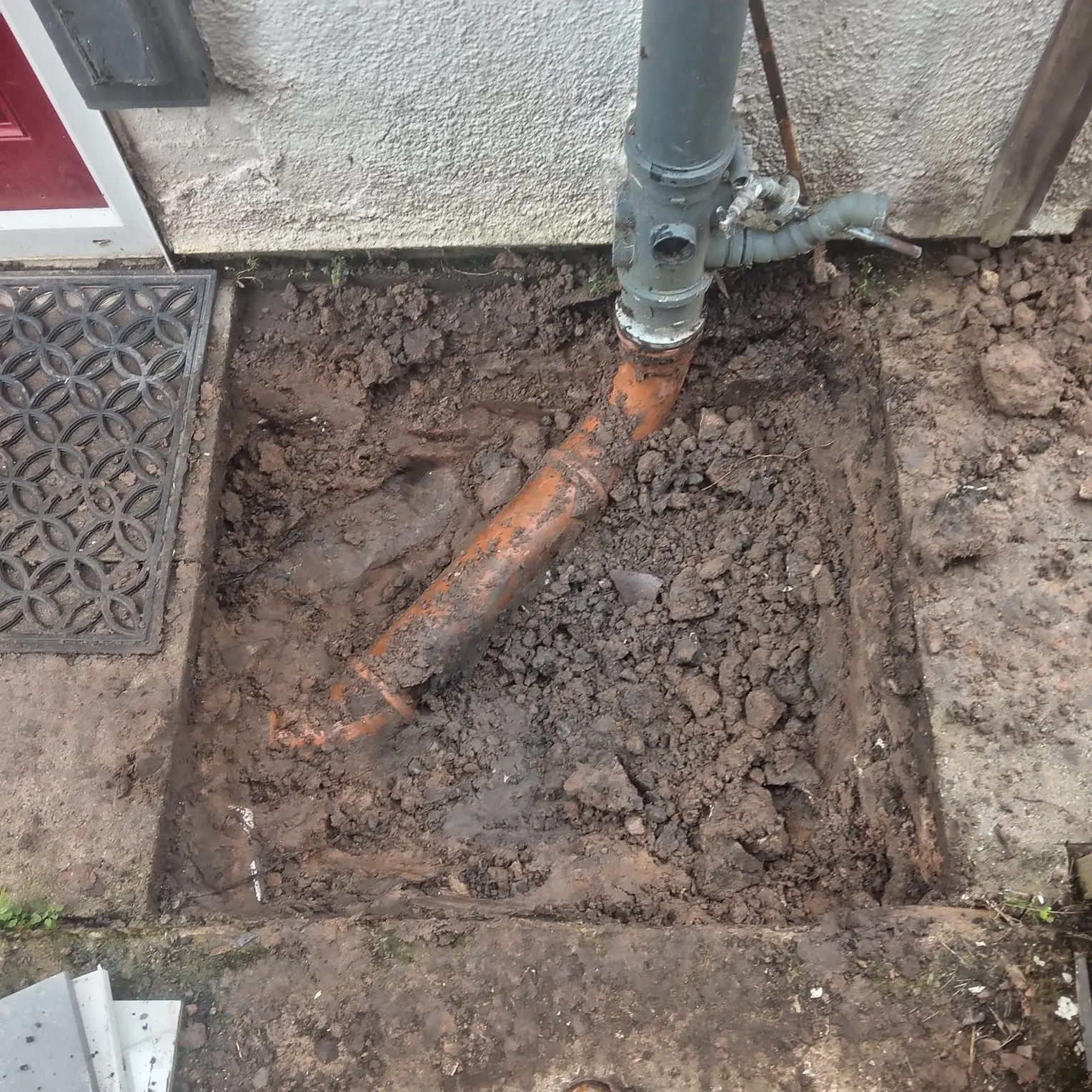 Exposed clay drainage pipe during drain repair works Preston