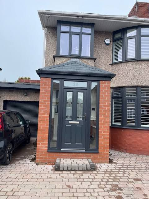 New brick porch extension with grey composite door and tiled roof Preston