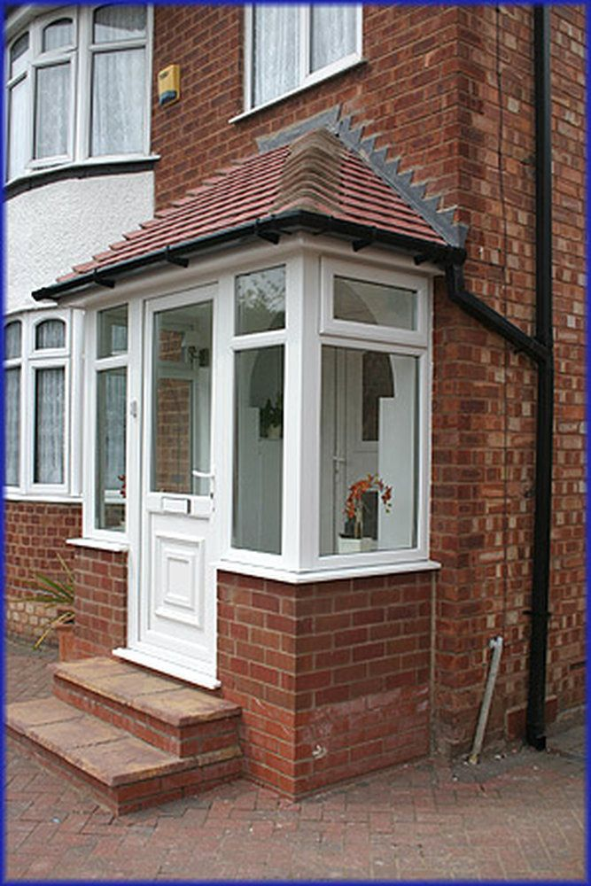 White uPVC porch build with red brick base and tiled roof Lancashire
