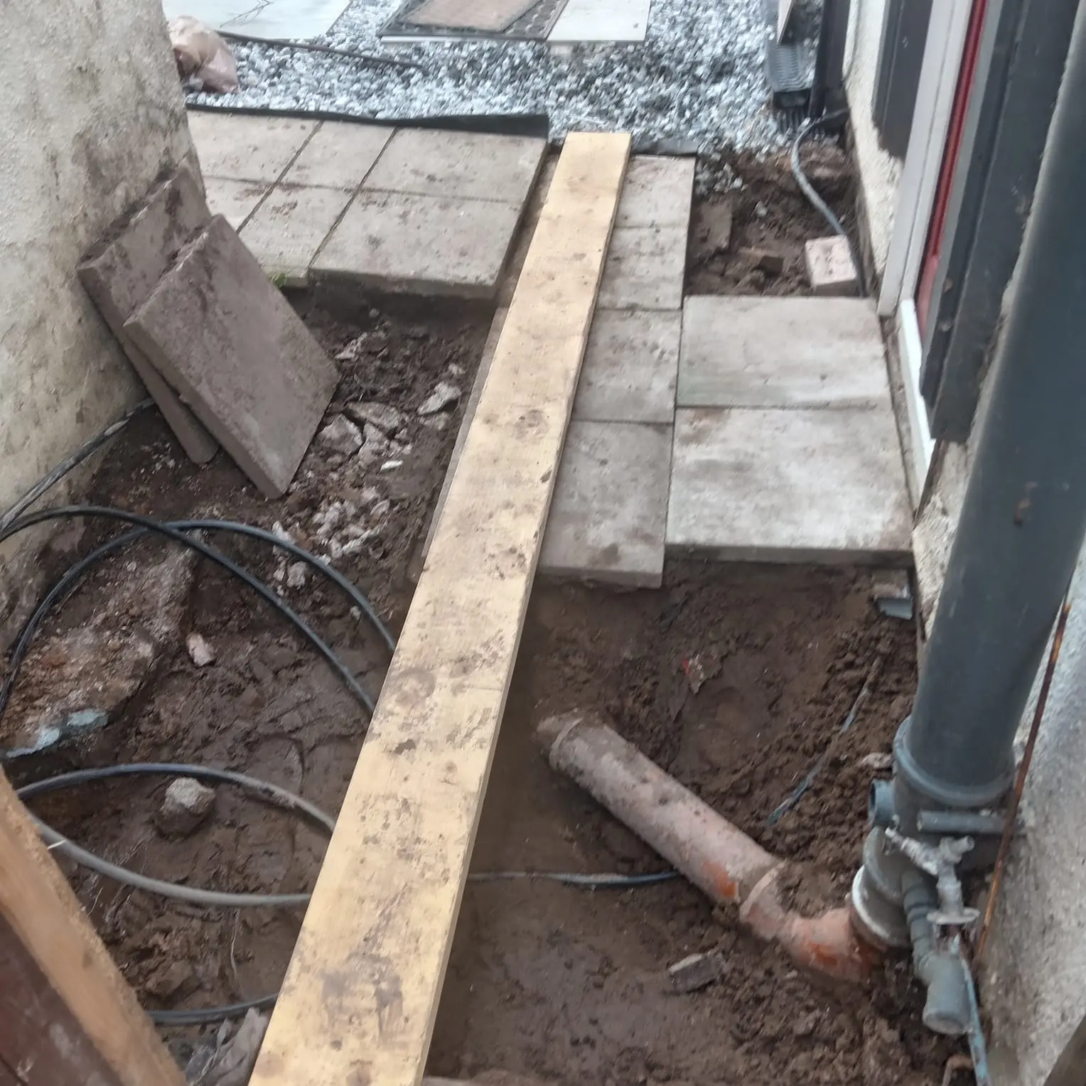 Reset paving slabs and repaired soil pipe connection Preston