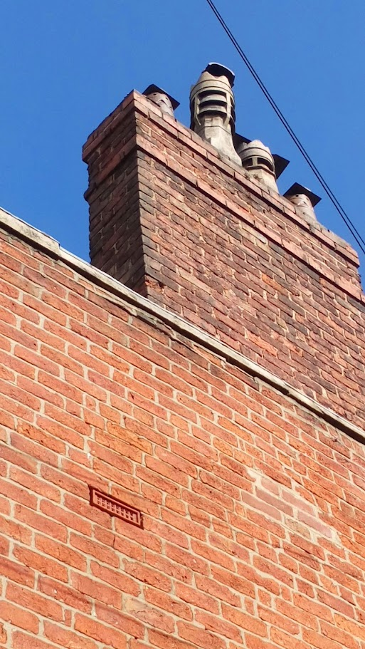 Repointed chimney stack with new pots and cowls Preston